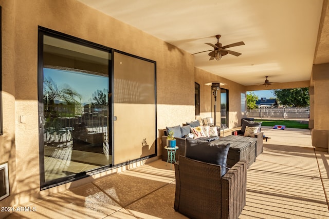 deck with ceiling fan and a patio