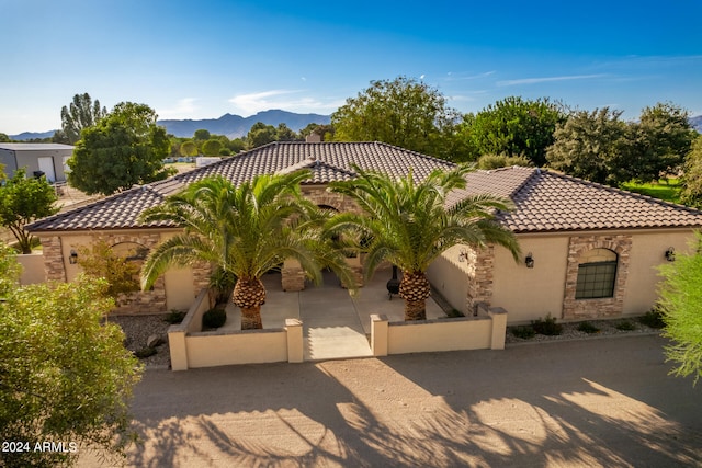 mediterranean / spanish-style home featuring a mountain view