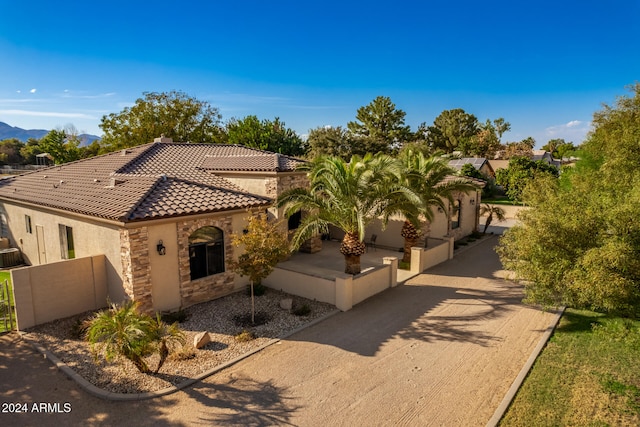 mediterranean / spanish home with a mountain view