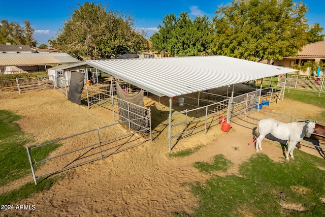 view of stable featuring a rural view