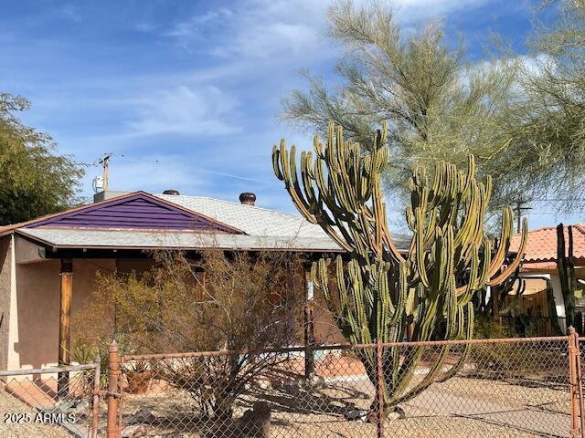 view of property exterior with fence