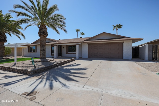 ranch-style house featuring a garage