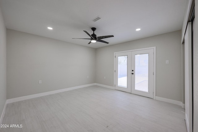 unfurnished room featuring french doors, light hardwood / wood-style floors, and ceiling fan