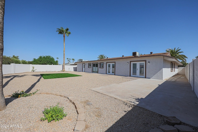 back of house featuring french doors and a patio