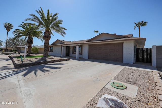 ranch-style house featuring a garage