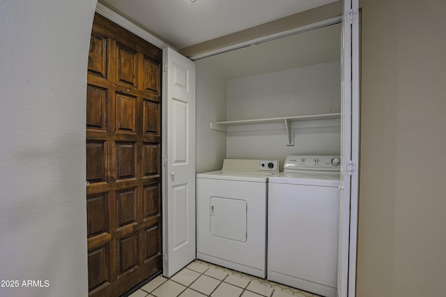 10410 N Cave Creek Rd Unit 2220, Phoenix, AZ 85020 - laundry room with washer and dryer and light tile patterned floors