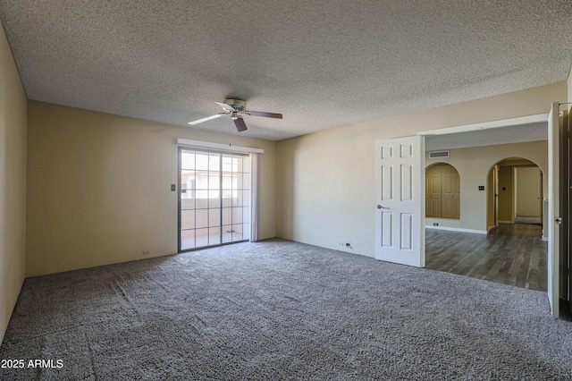 10410 N Cave Creek Rd Unit 2220, Phoenix, AZ 85020 - carpeted empty room with a ceiling fan, arched walkways, and a textured ceiling