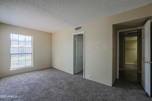 10410 N Cave Creek Rd Unit 2220, Phoenix, AZ 85020 - unfurnished bedroom featuring carpet and a textured ceiling