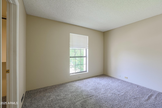 10410 N Cave Creek Rd Unit 2220, Phoenix, AZ 85020 - carpeted empty room featuring a textured ceiling