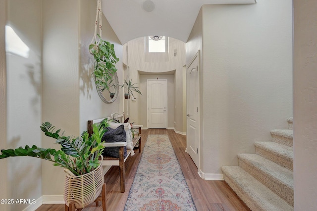 corridor featuring wood-type flooring