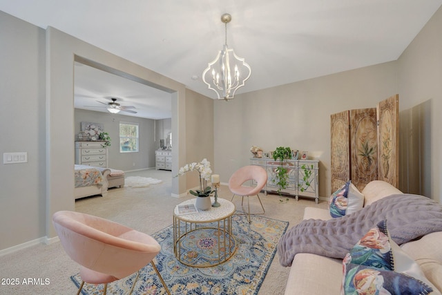 living room with an inviting chandelier and light colored carpet