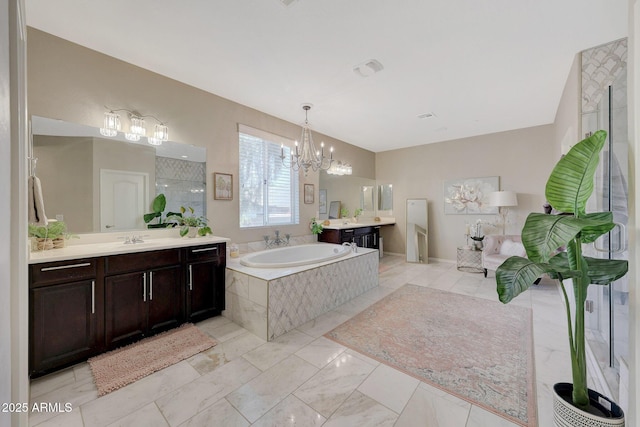 bathroom with vanity, shower with separate bathtub, and an inviting chandelier