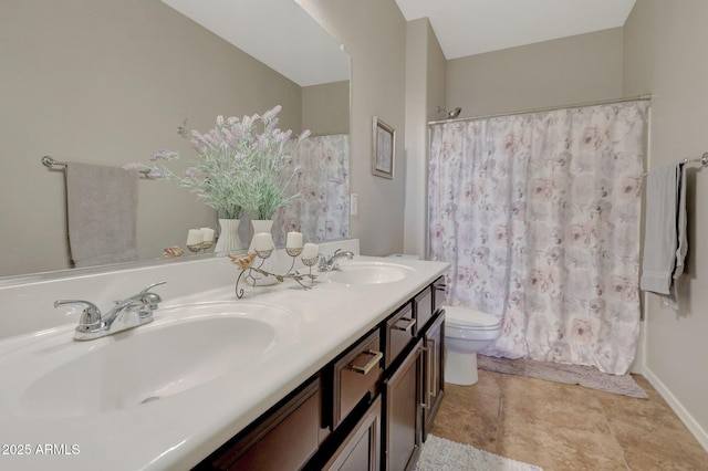 bathroom featuring toilet, a shower with shower curtain, and vanity