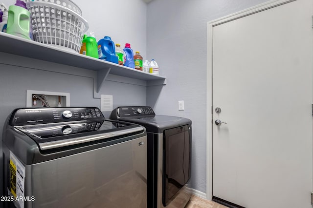 laundry area with washing machine and dryer