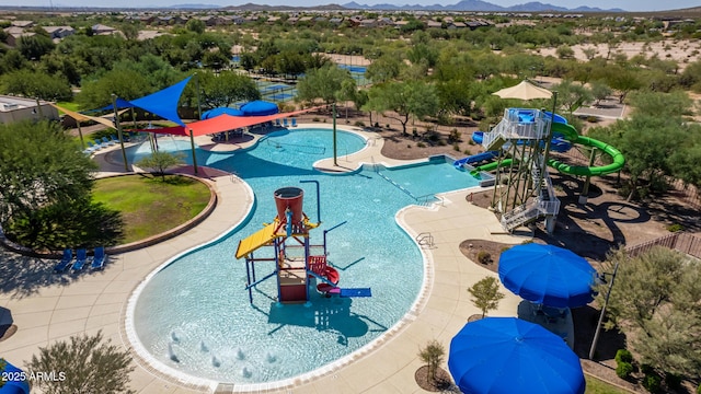 view of pool featuring a playground