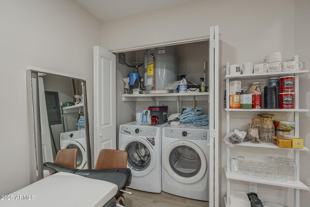2038 E River Rd Unit 101, Tucson, AZ 85718 - laundry area with washer and clothes dryer and wood finished floors