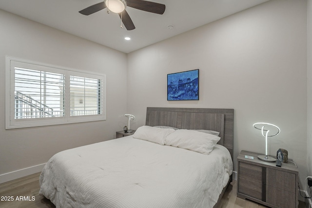 2038 E River Rd Unit 101, Tucson, AZ 85718 - bedroom featuring baseboards, wood finished floors, a ceiling fan, and recessed lighting