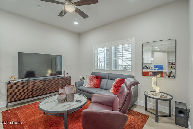 2038 E River Rd Unit 101, Tucson, AZ 85718 - living area with a ceiling fan, wood finished floors, baseboards, and recessed lighting