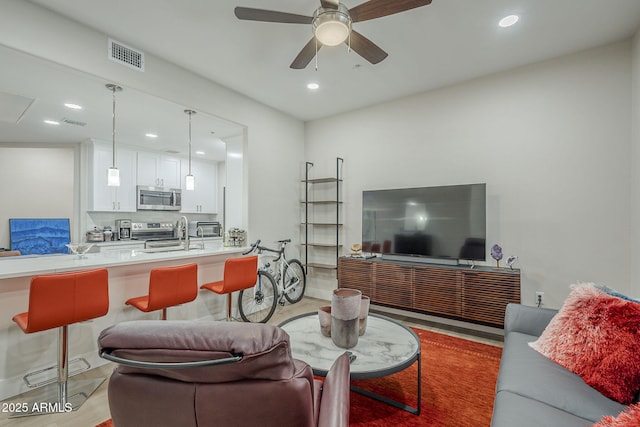 2038 E River Rd Unit 101, Tucson, AZ 85718 - living room with recessed lighting and ceiling fan