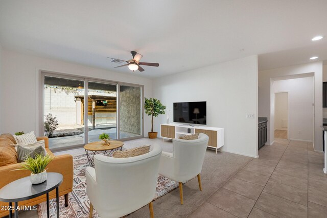 living room with ceiling fan and light tile patterned floors