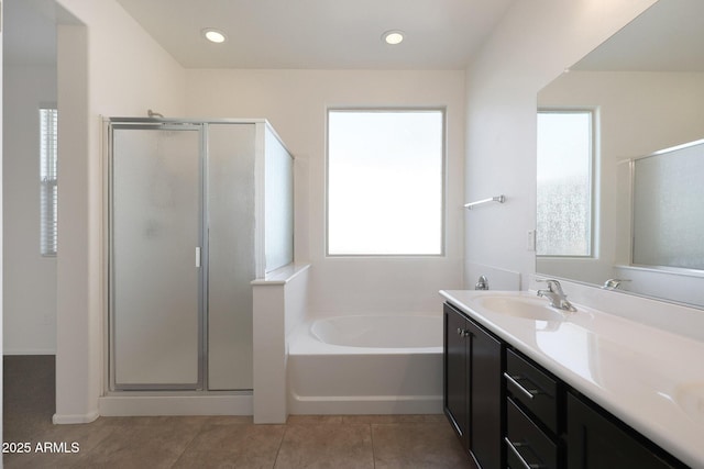 bathroom with independent shower and bath, tile patterned flooring, and vanity