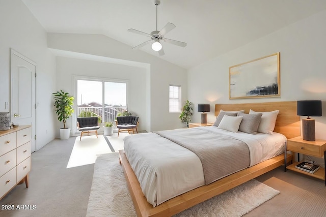 bedroom featuring a ceiling fan, light carpet, and lofted ceiling