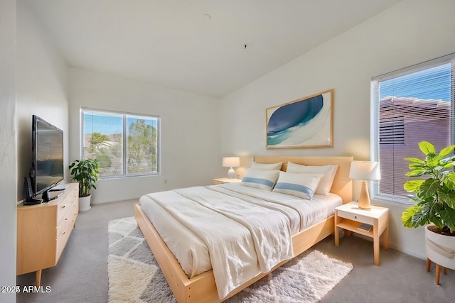 bedroom featuring light carpet