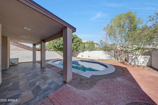 view of swimming pool featuring a patio, a fenced backyard, and a fenced in pool