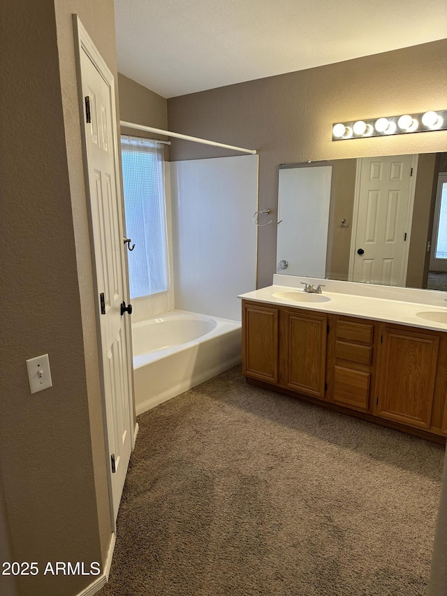 bathroom with vanity and a bathing tub