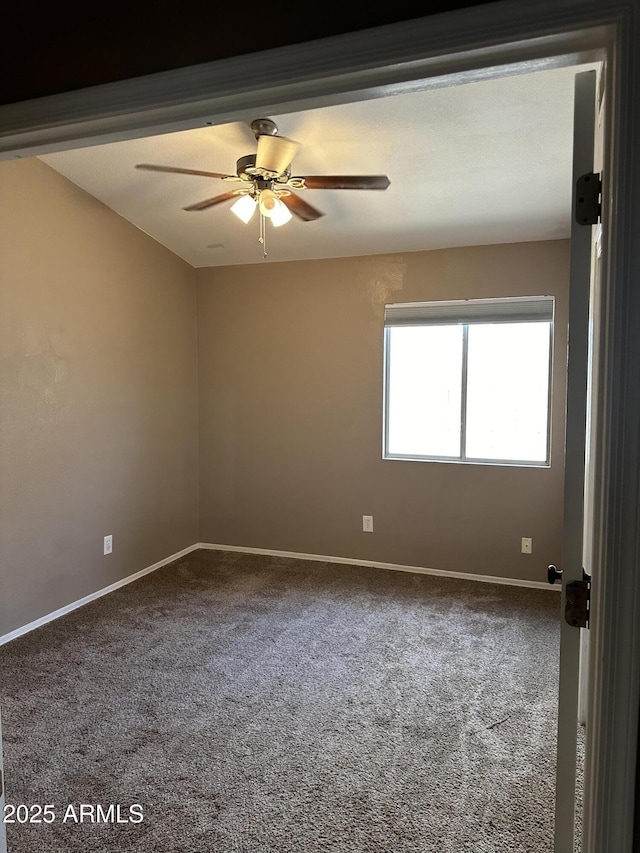 empty room with carpet flooring and ceiling fan