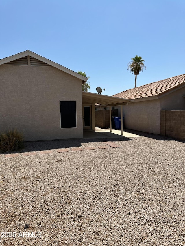 back of property featuring a patio