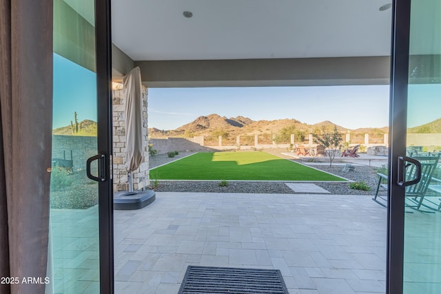 view of patio / terrace featuring a mountain view