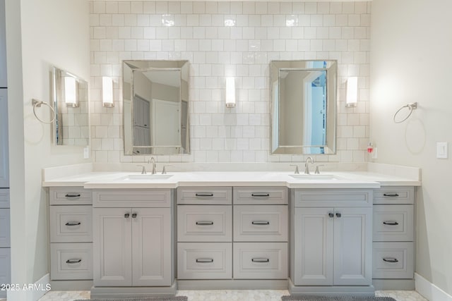 bathroom with vanity and decorative backsplash