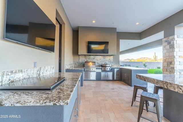 kitchen featuring tasteful backsplash and sink