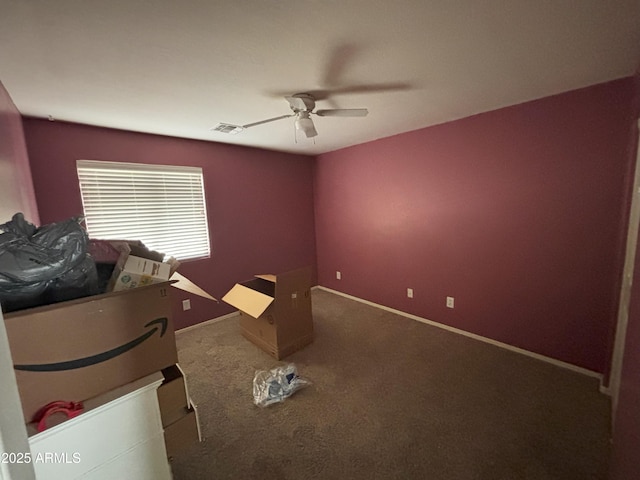 unfurnished bedroom with ceiling fan and carpet floors