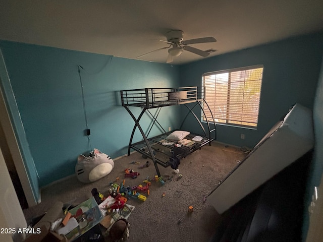 unfurnished bedroom with ceiling fan and carpet flooring