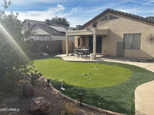 back of house with a patio