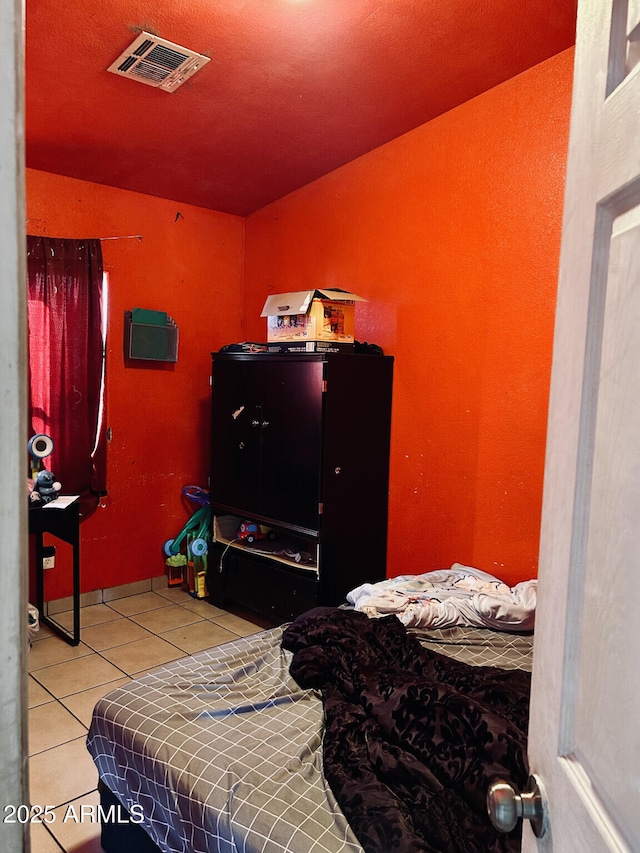 bedroom with tile patterned floors