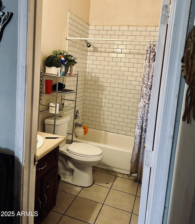 full bathroom with vanity, toilet, tile patterned floors, and shower / bath combo with shower curtain