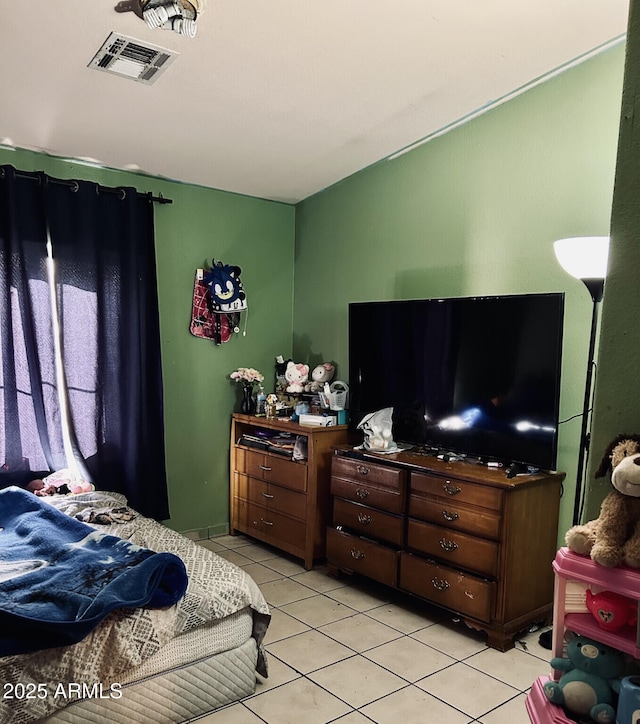 bedroom featuring light tile patterned flooring