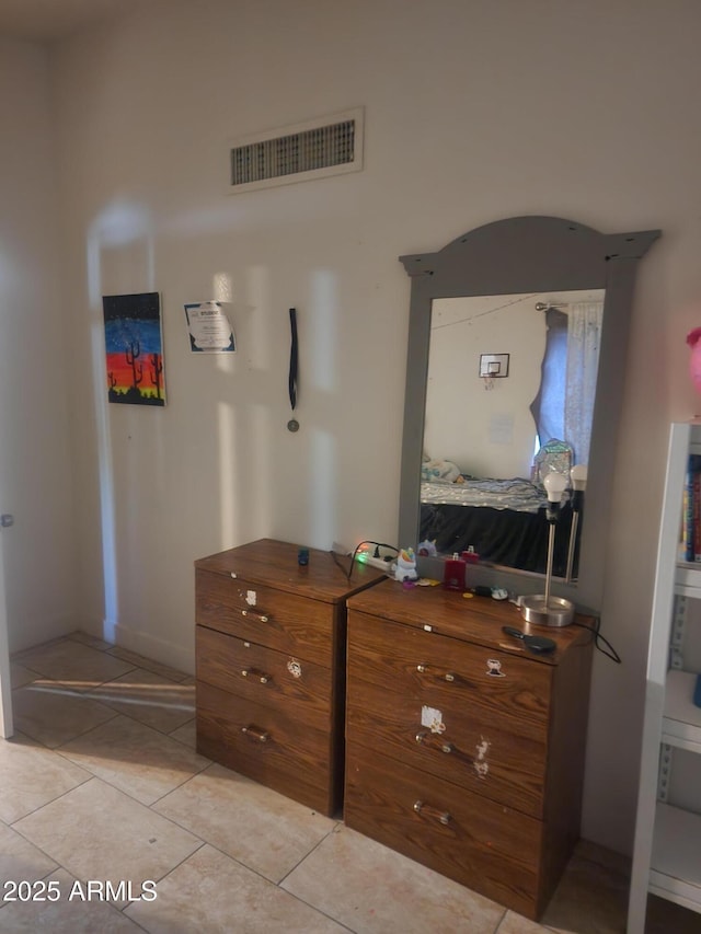 bedroom featuring light tile patterned floors and visible vents