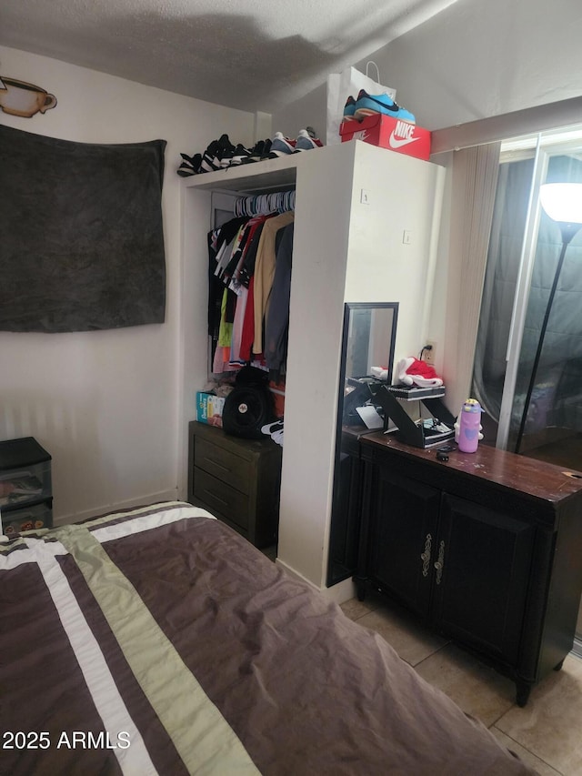 bedroom featuring light tile patterned flooring