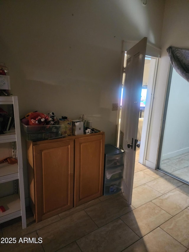 interior space featuring light tile patterned flooring