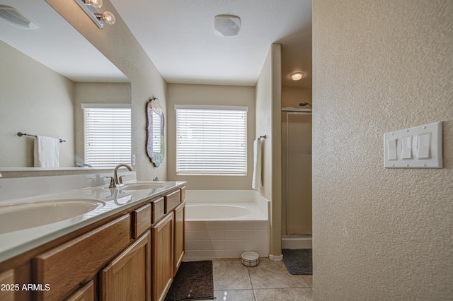 3790 W White Canyon Rd, San Tan Valley, AZ 85144 - bathroom featuring a bath, a stall shower, double vanity, tile patterned floors, and a textured wall