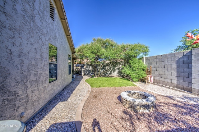 3790 W White Canyon Rd, San Tan Valley, AZ 85144 - fenced backyard with an outdoor fire pit
