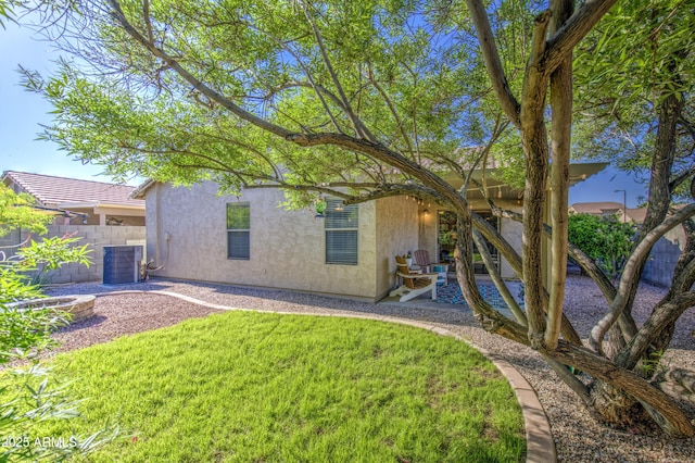 3790 W White Canyon Rd, San Tan Valley, AZ 85144 - back of property with stucco siding, central AC unit, and a patio area