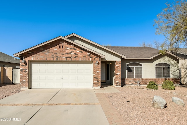 single story home with brick siding, driveway, and an attached garage