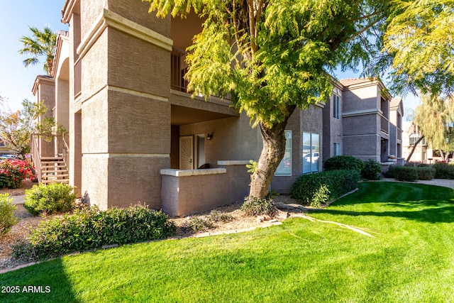 view of home's exterior with a lawn