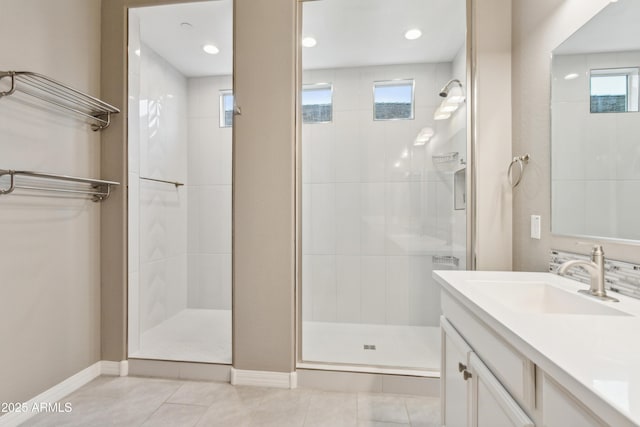 11609 W Andrew Ln, Peoria, AZ 85383 - bathroom featuring vanity, baseboards, a shower stall, and a healthy amount of sunlight