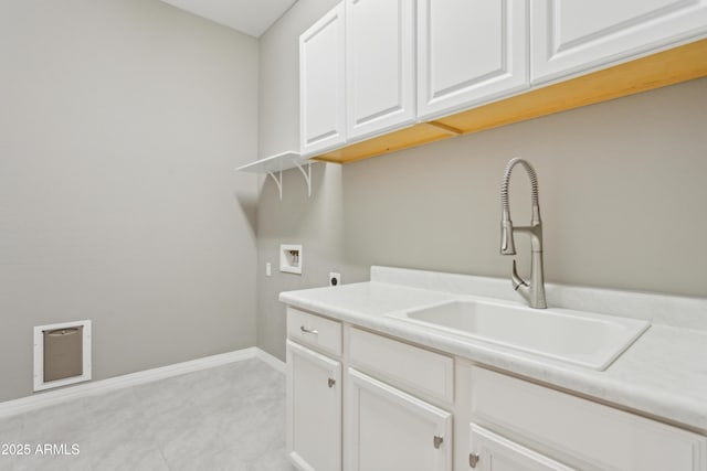 11609 W Andrew Ln, Peoria, AZ 85383 - laundry area with baseboards, hookup for a washing machine, a sink, hookup for an electric dryer, and cabinet space